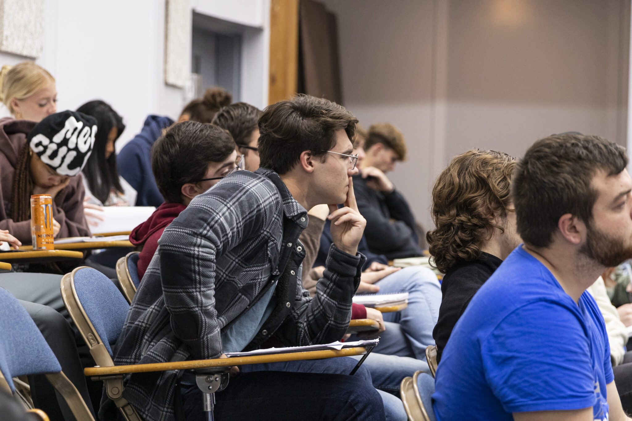 Group of multi-ethnic, mixed-gender students taking a theology course together