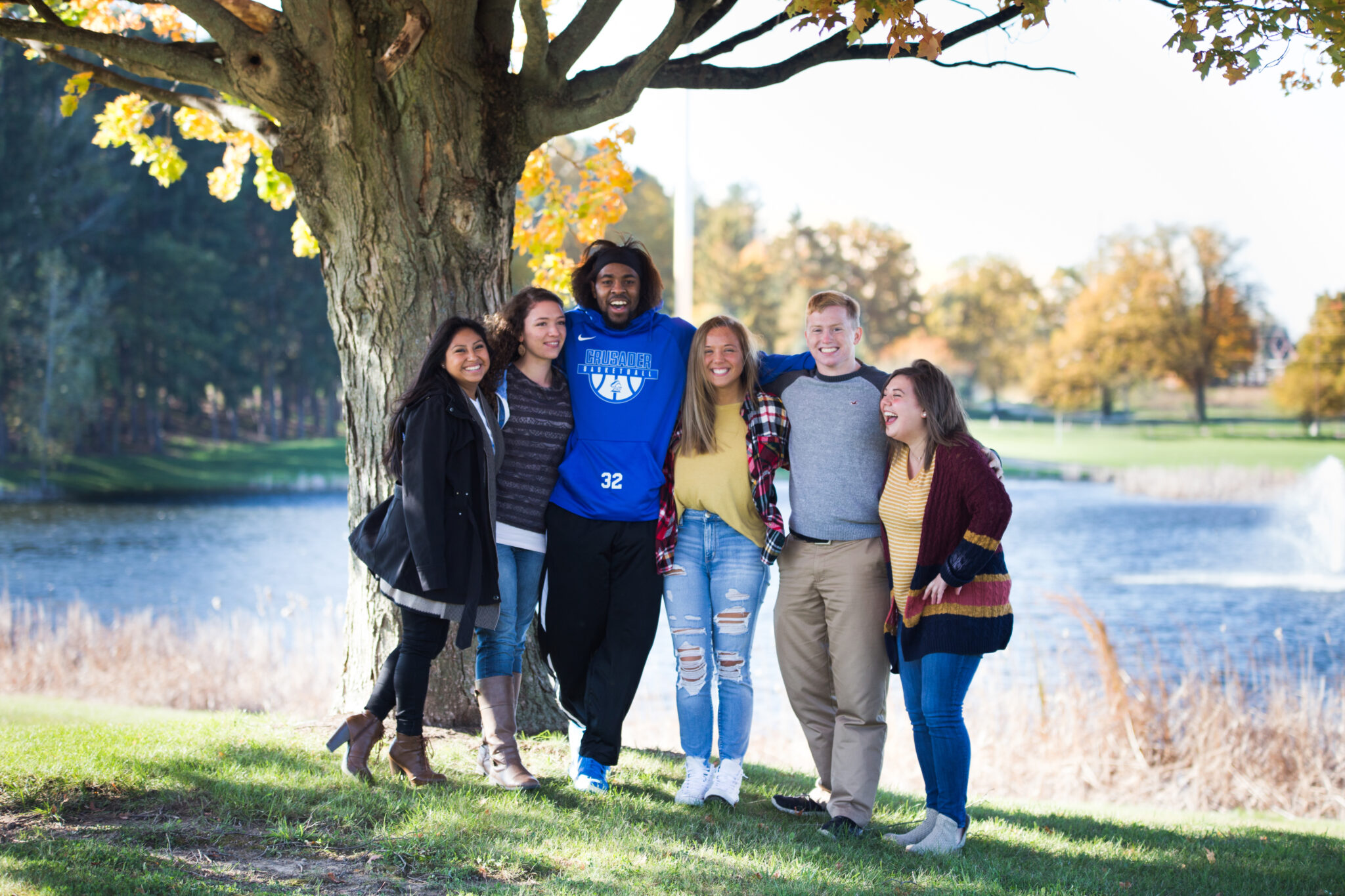 Group of students outside enjoying small college life on the beautiful GLCC campus