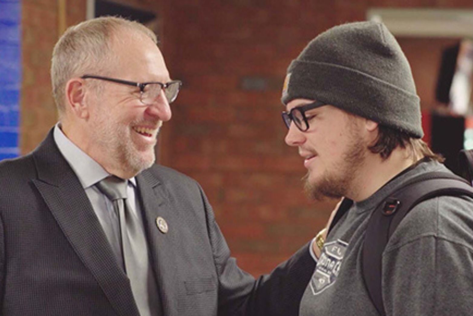 student and professor talking