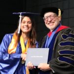 GLCC President Weller handing diploma to 2026 Valedictorian